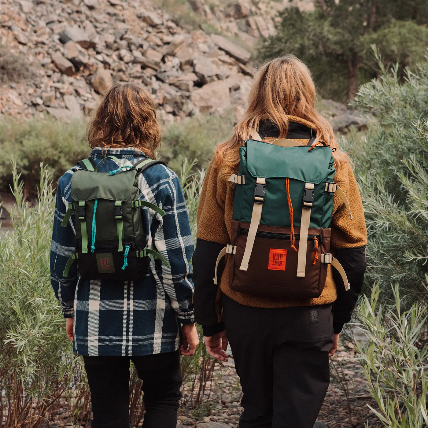 hiking women wearing mini and classic rover pack classic backpacks topo designs