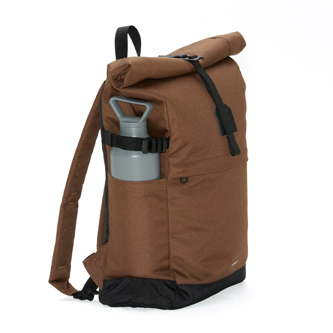 Brown Icon Rolltop 14" backpack side view with grey water bottle in side pocket
