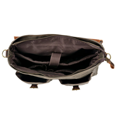 interior view of the padded laptop sleeve, slot pockets, zipped pocket and zipped opening of the messenger bag from eiken, tulsa model