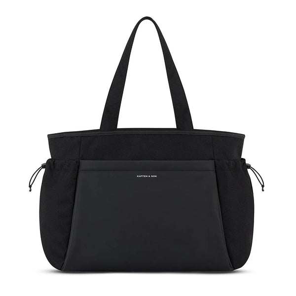 Kapten & Son Hellvi Pro Large shoulder bag in black, vegan PU front panel and side pockets with elastic drawcord