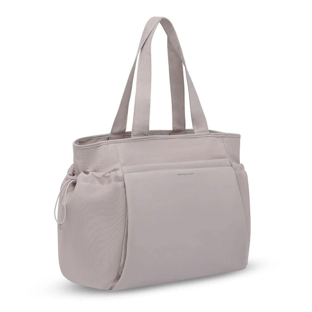 Side angle showing drawstring pocket and logo — muted rose