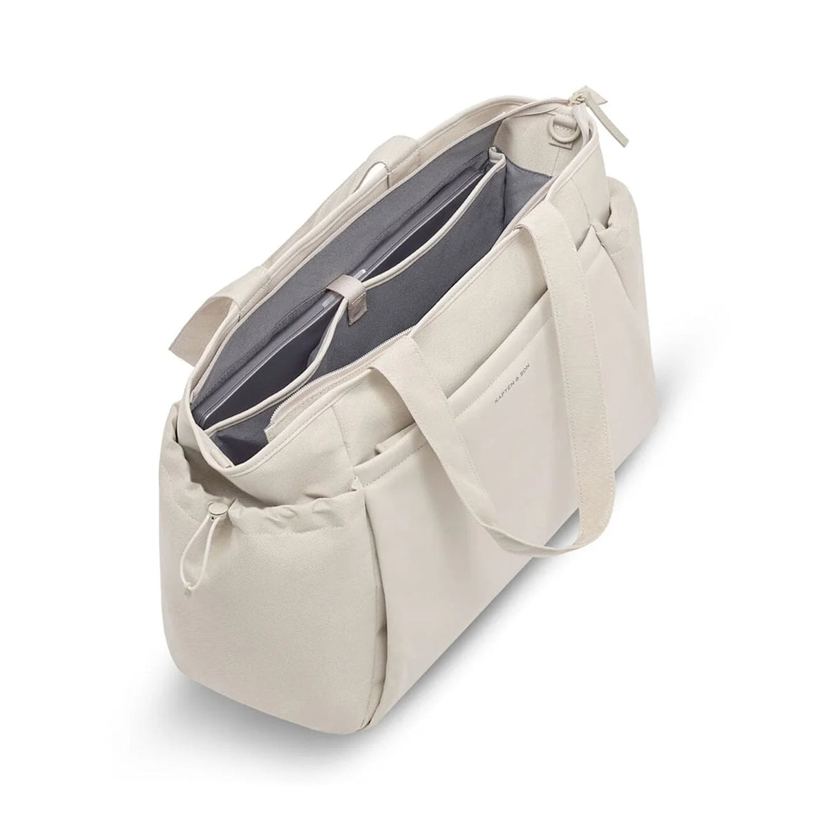 Open top showing padded laptop sleeve and grey interior — sandstone