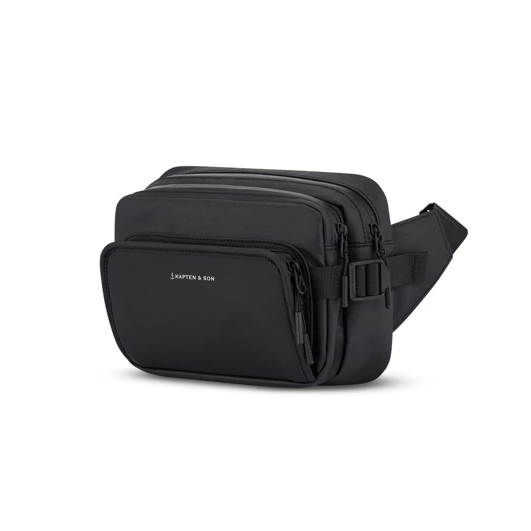 Three-quarter view showing multiple zip compartments — black