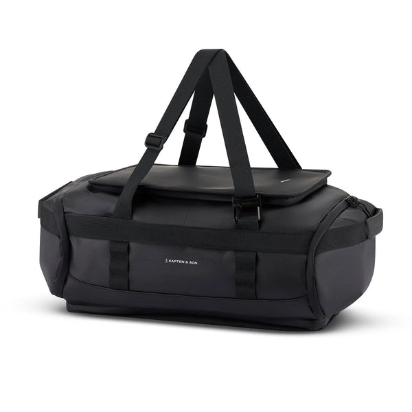 Kapten & Son Lisbon Duffle Backpack Small 33L in black — side view with grab handles
