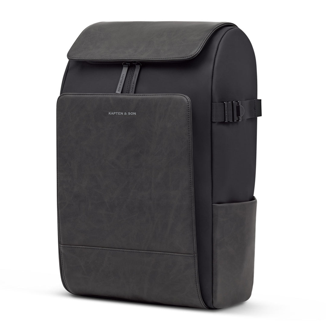 Kapten & Son Bali Pro backpack in black — front three-quarter view with side bottle pocket