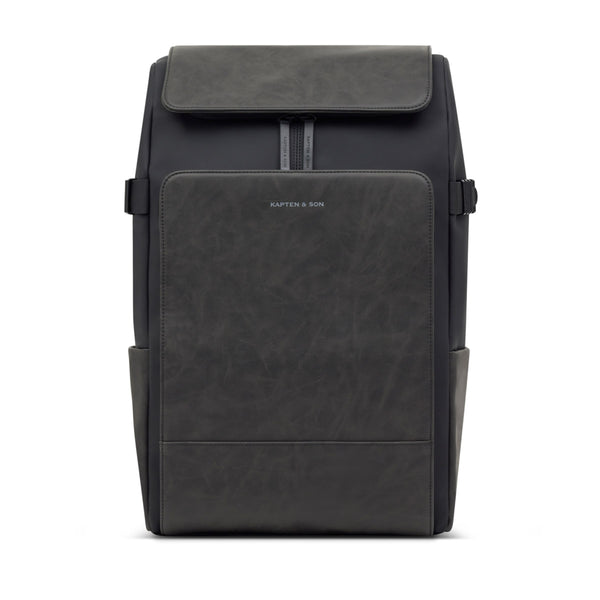 Kapten & Son Bali Pro backpack in black — front view with grey vintage leather-look flap and laptop pocket