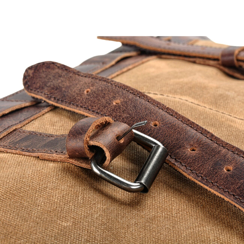 khaki waxed canvas duffle bag buckle close up