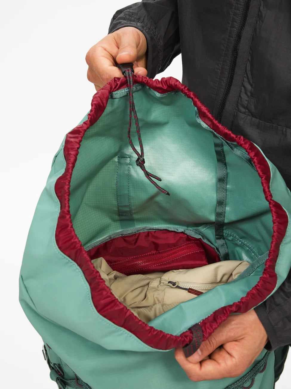 Ull Backpack 30L in jade green with main compartment open showing interior organization