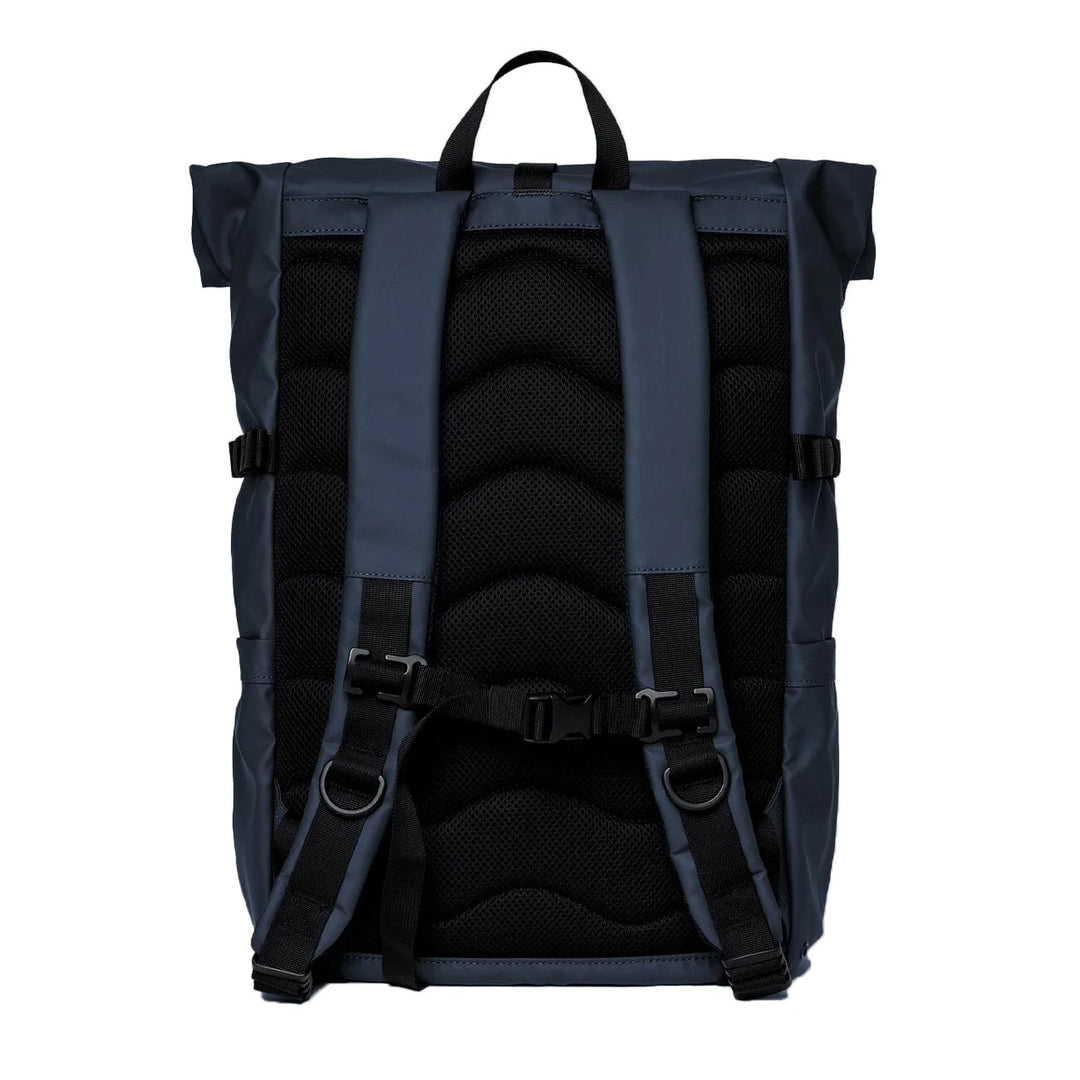 Woman wearing Sandqvist Stream Rolltop Backpack L in dawn green, back view trail