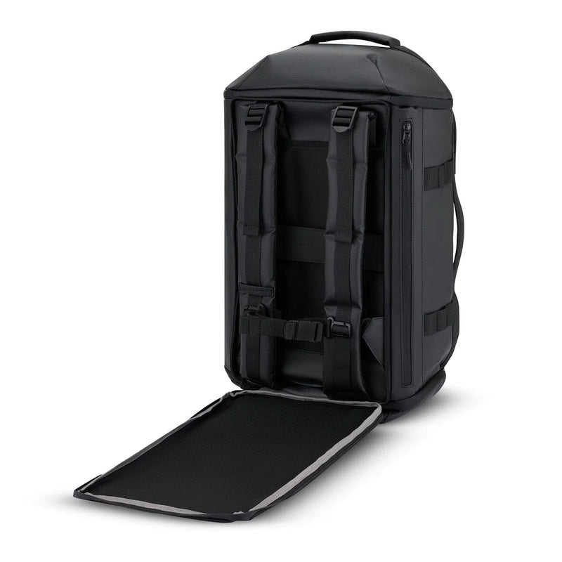 Shoulder straps stowed behind the back panel of the black Lisbon Duffle Backpack Small