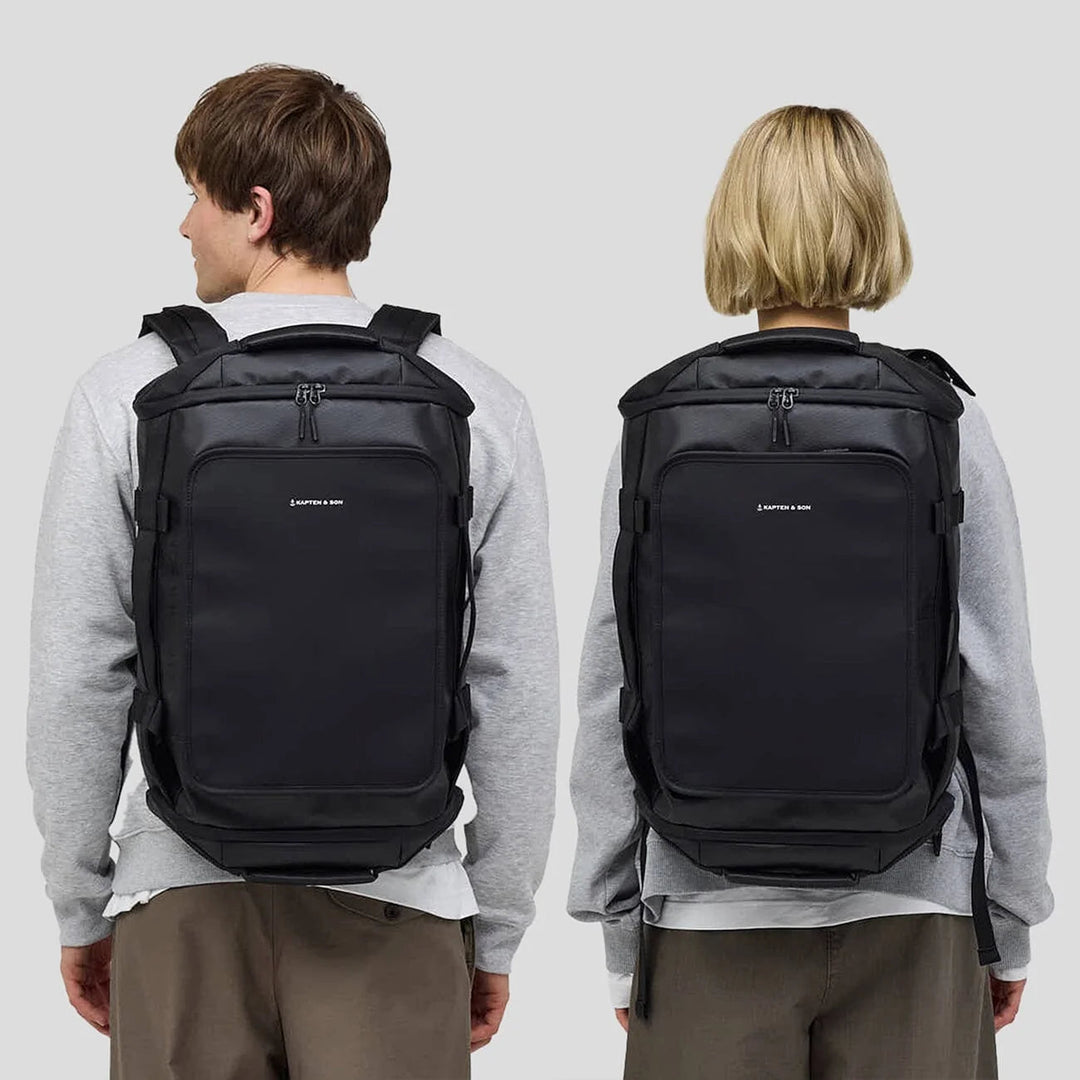 Rear view lifestyle shot showing the backpack fit on two body types