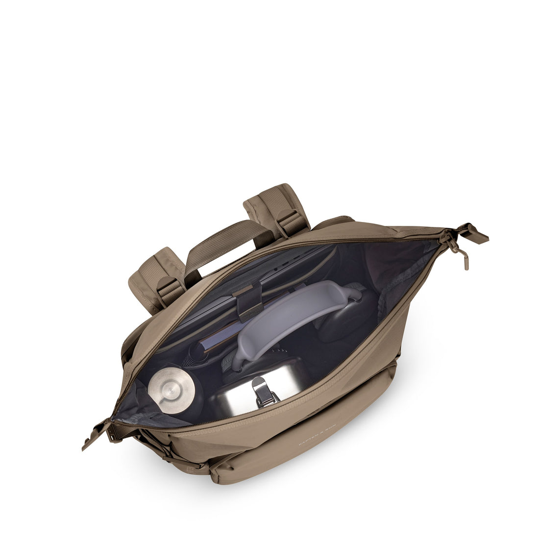 Packed with bottle and gear — top view into open rolltop, walnut