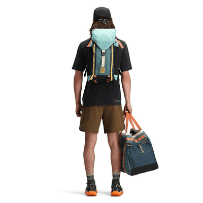 man carrying geode green sea pine mountain pack