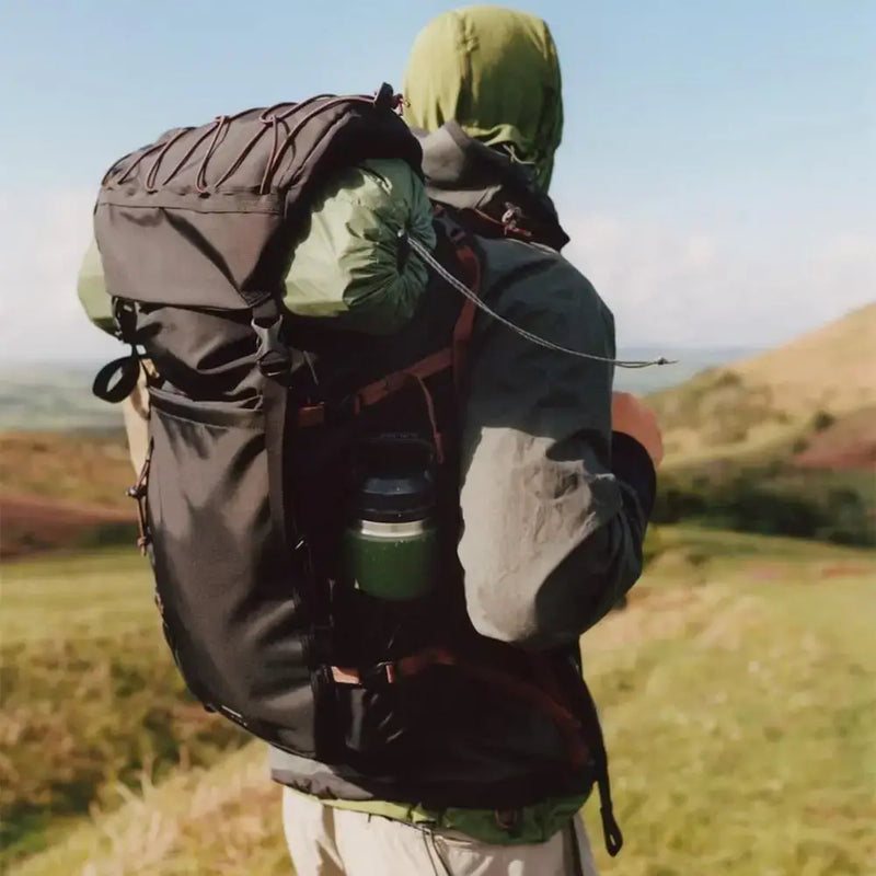 man hiking wearing sandqvist mountain hike backpack black