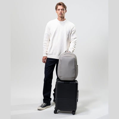 man holding suitcase with kapten son olso black greige