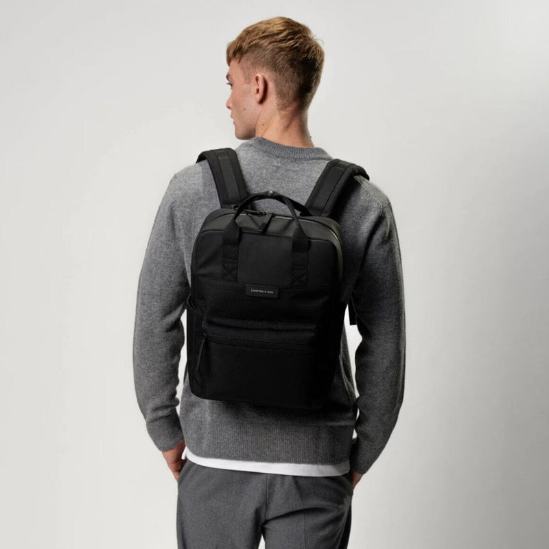 man wearing all black bergen pro backpack kapten son