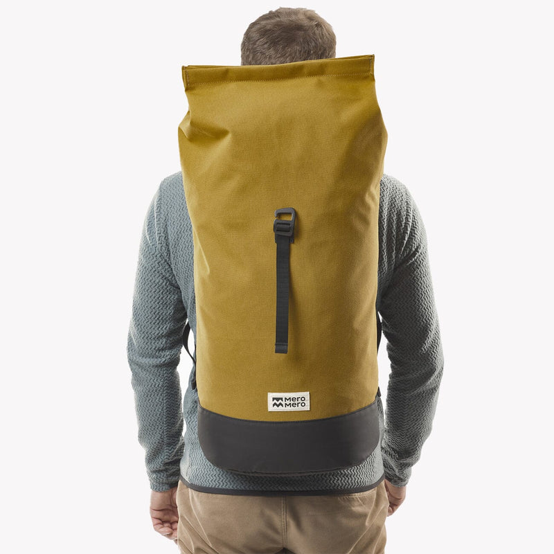 man wearing chai tea roll top squamish backpack mero mero unrolled back view