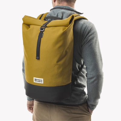 man wearing chait tea roll top squamish backpack meromero rolled back view