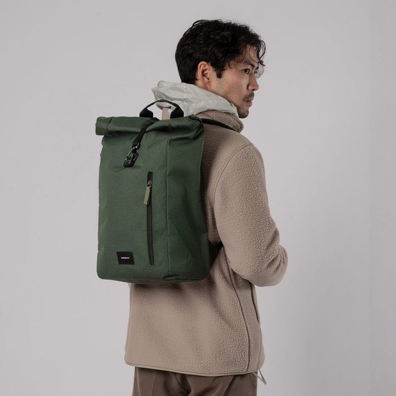 man wearing dante vegan sandqvist backpack green