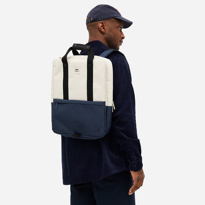 Back view of man wearing an environmentally friendly blue and white daypack