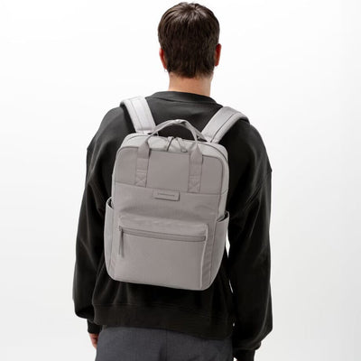 man wearing greige bergen pro backpack kapten son