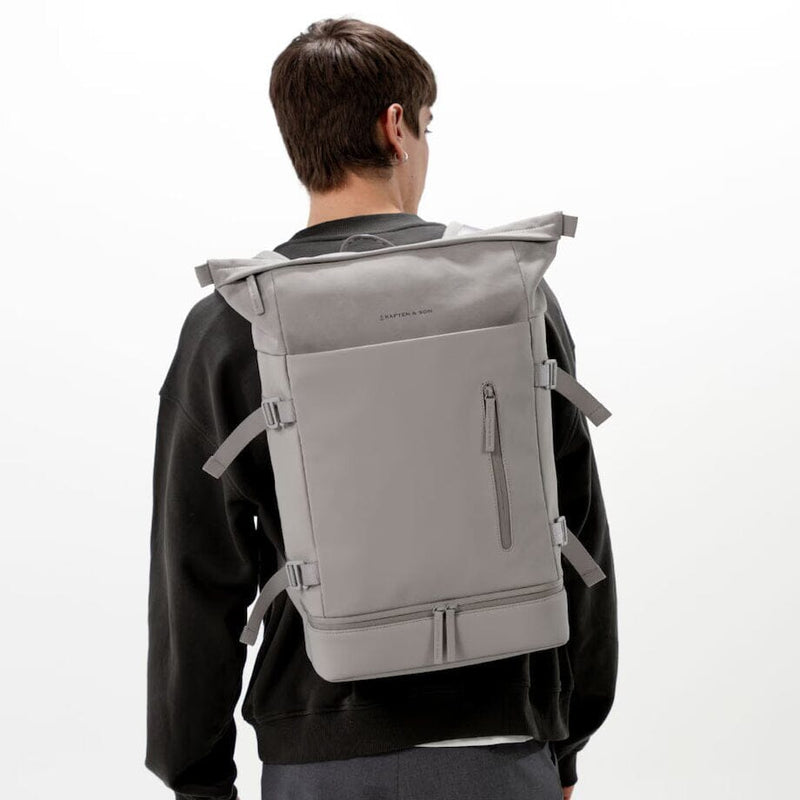 man wearing greige helsinki backpack kapten son model lifestyle