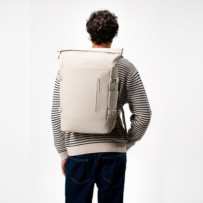 man wearing kapten and son helsinki pro backpack sandstone, back view