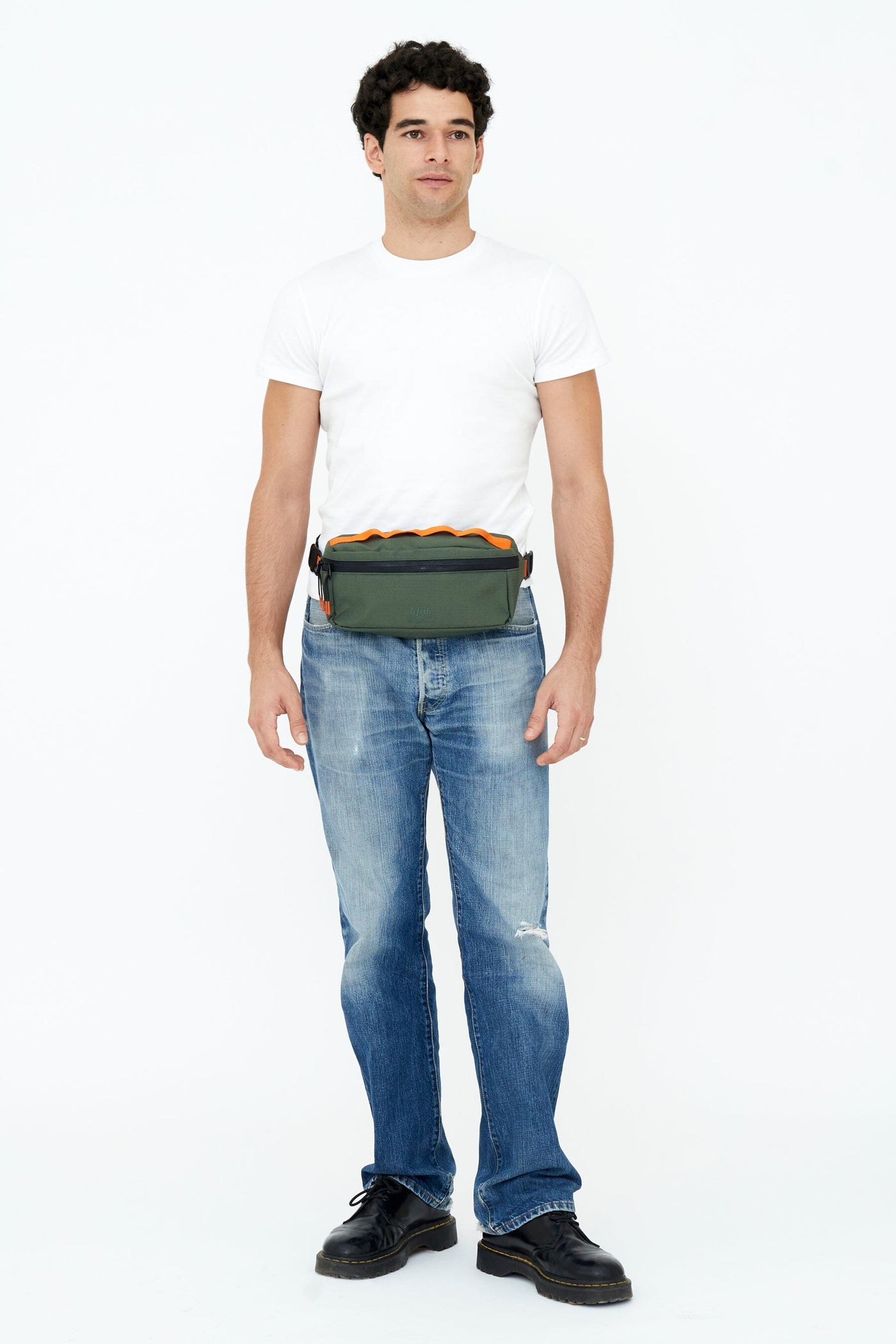 man wearing lefrik core sustainable chest bag pine color