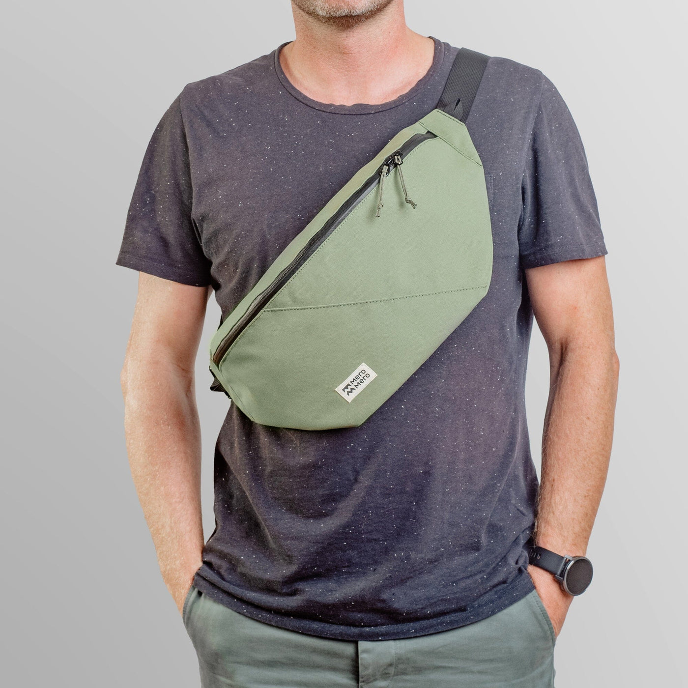 man wearing mero mero hoian recycled bum bag as cross body bag