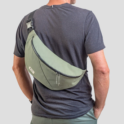 man wearing mero mero hoian recycled bum bag as sling bag
