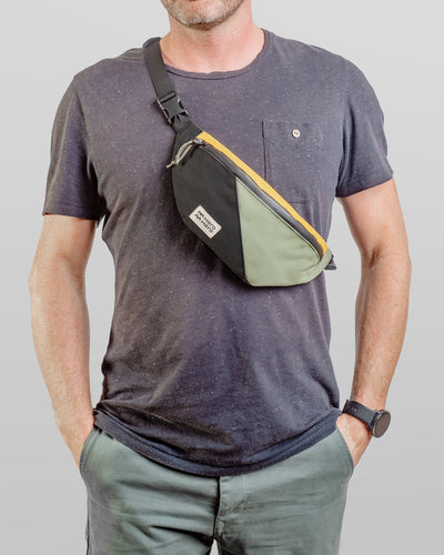 man wearing mero mero mini hoian small recycled fanny pack as chest bag