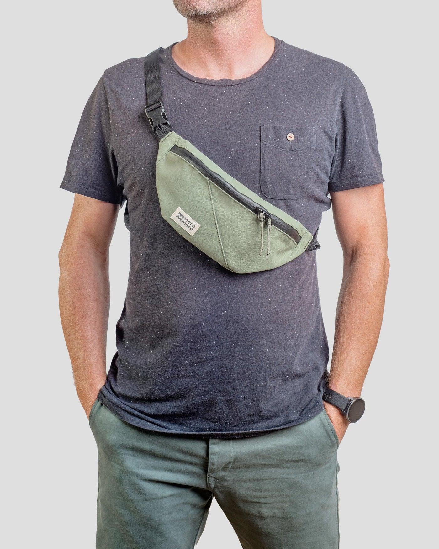 man wearing mero mero mini hoian small recycled fanny pack as cross body bag