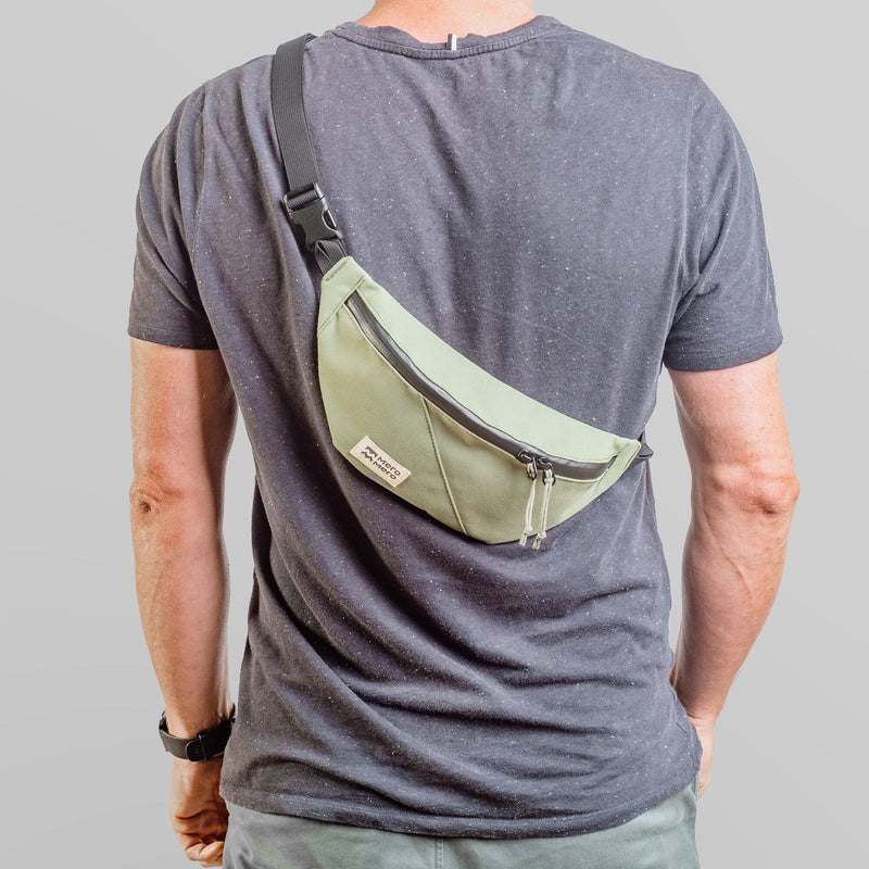 man wearing mero mero mini hoian small recycled fanny pack as sling bag