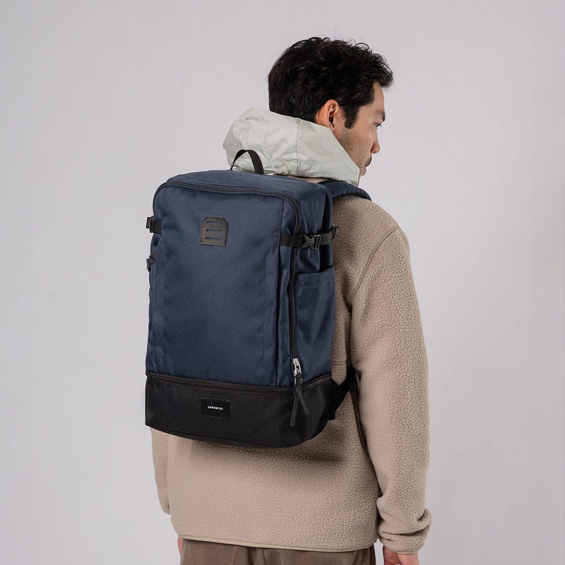 man wearing sandqvist alde in multi navy, back view