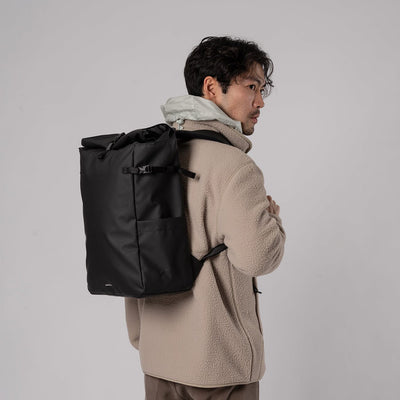 man wearing sandqvist arnold black backpack lifestyle