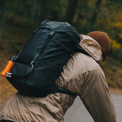 man wearing sandqvist jonatan black backpack cycling