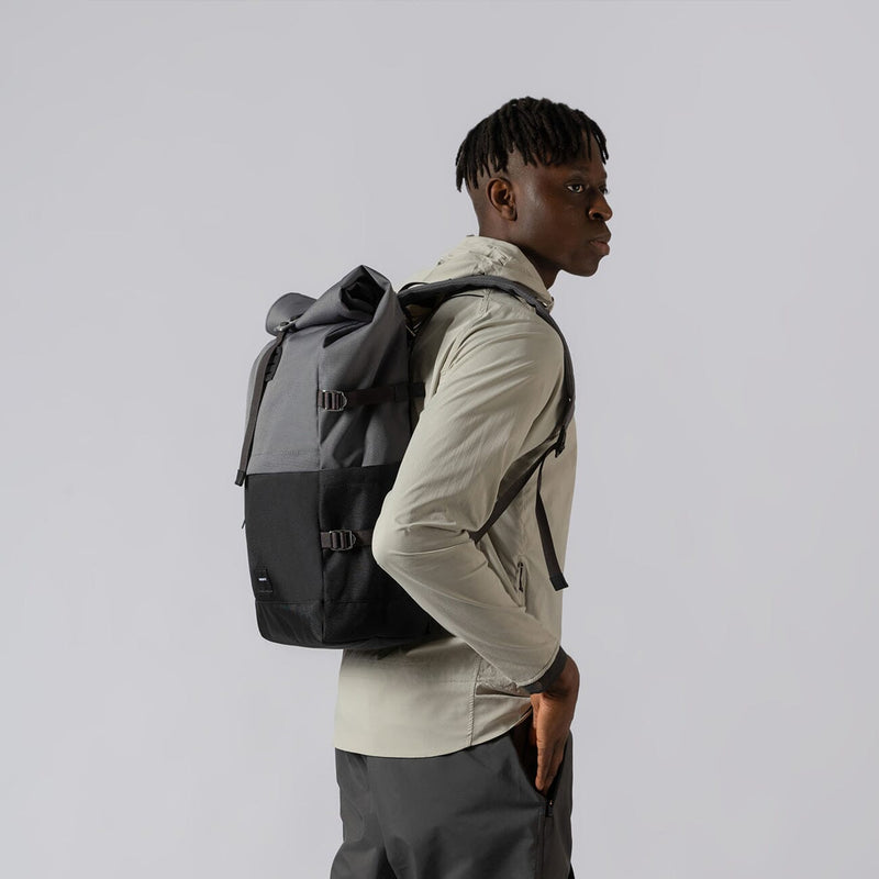 man wearing sandqvist multi dark bernt backpack