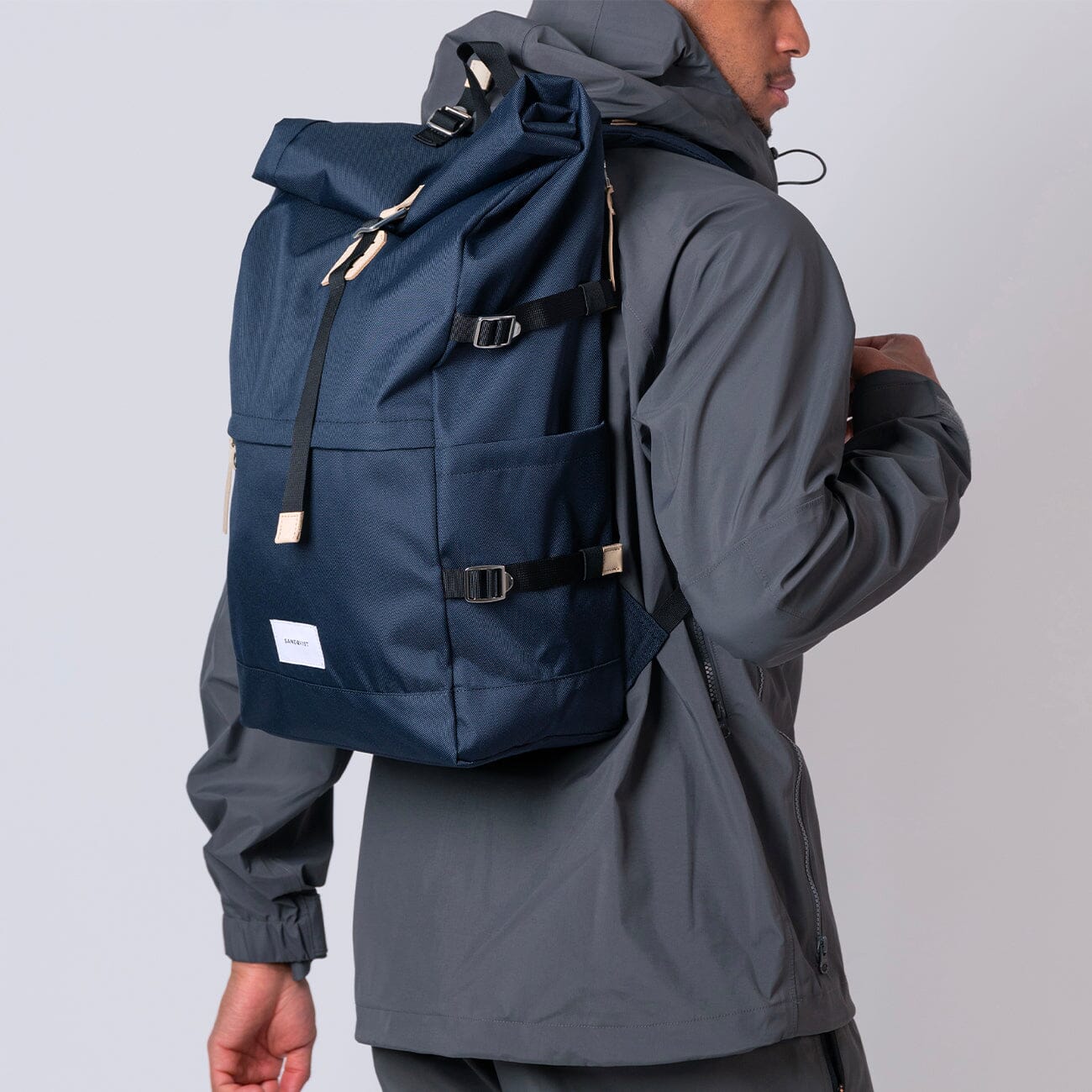 man wearing sandqvist navy blue bernt backpack