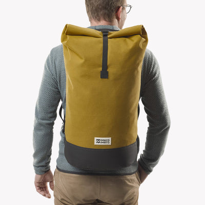 man wearing squamish v3 backpack in chai tea, mero mero, back view