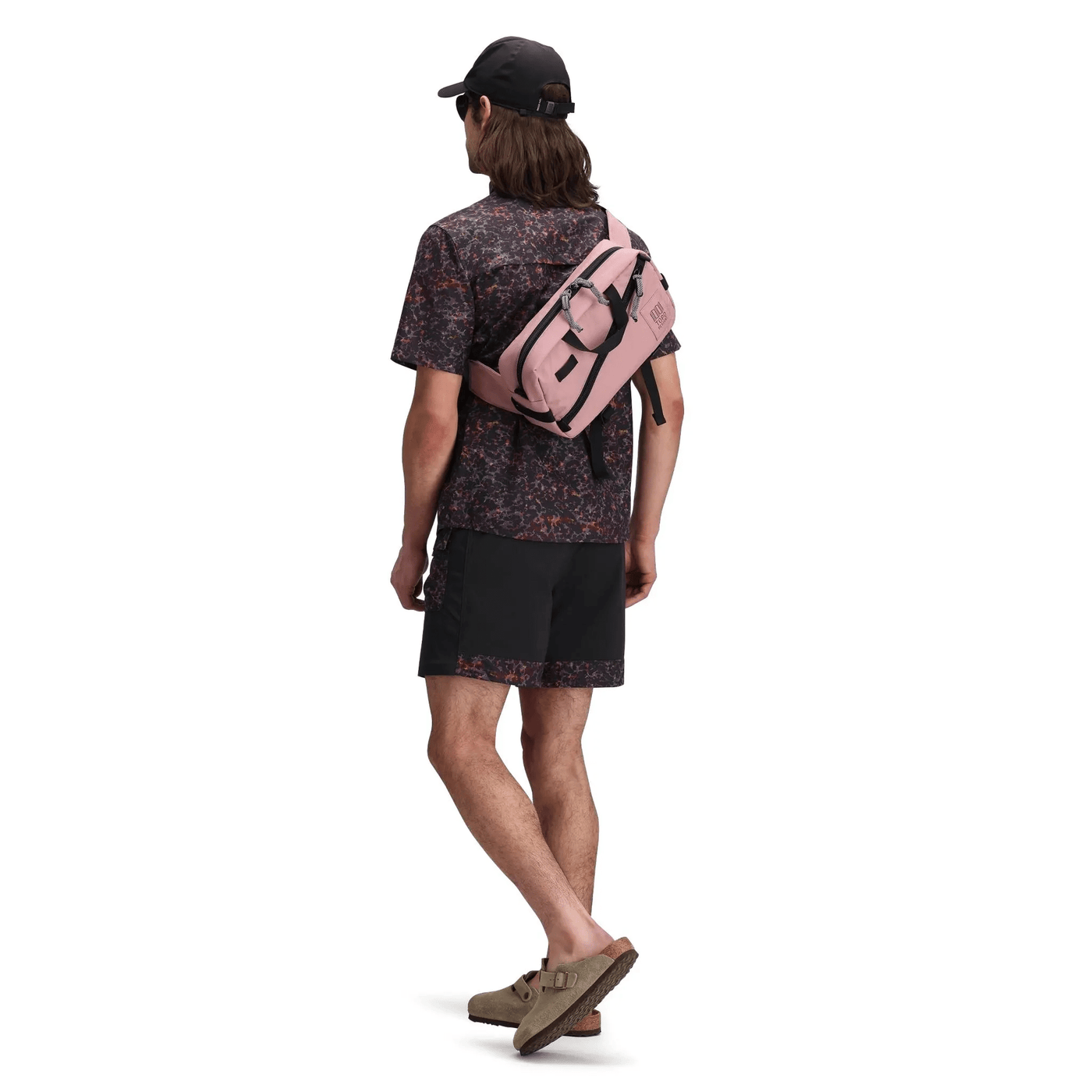 man wearing topo designs quick pack 3.7L as over the shoulder bag