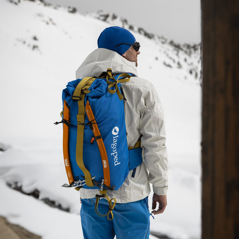 skier on the terrace of a mountain hut wearing lagoped's kiiruna2 in royal blue