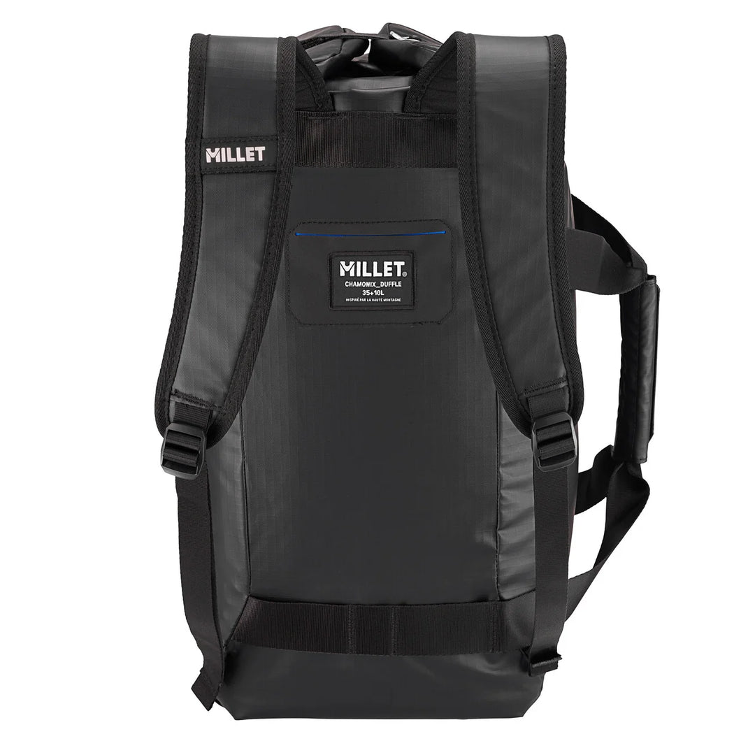 Millet Chamonix Duffle 35+10L Black — back view in backpack mode with padded shoulder straps and Millet label