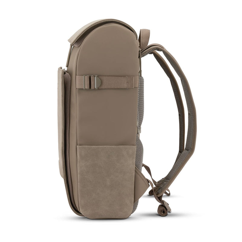 Streamlined side profile of the minimalist daypack in walnut tone, crafted from water-repellent recycled materials