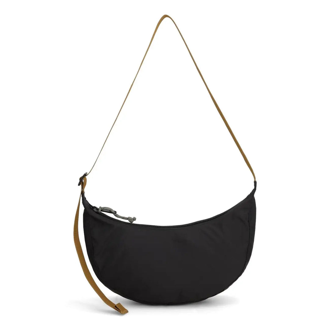 Rear view of the Moonlight Crossbody Bag in black and neutral