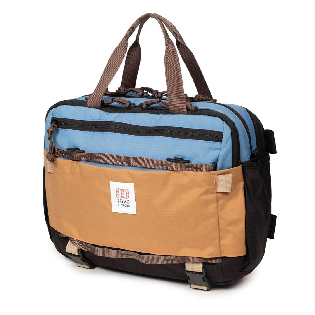 Mountain Cross Bag 14L in River Blue and Cobblestone — three-quarter view with the shoulder strap attached
