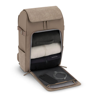 Open view of the travel backpack revealing its spacious, organized interior with compartments for clothes and accessories