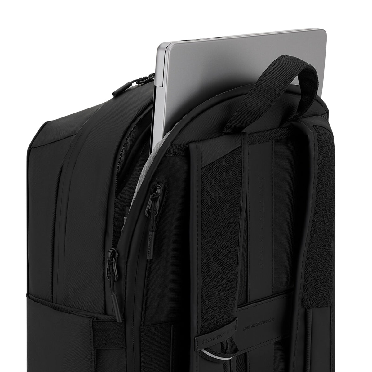 Laptop slid into the padded back compartment of the black Oslo