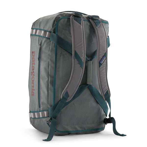Patagonia Black Hole Duffel 55L Noble Grey — side view in duffel mode with red Patagonia logo
