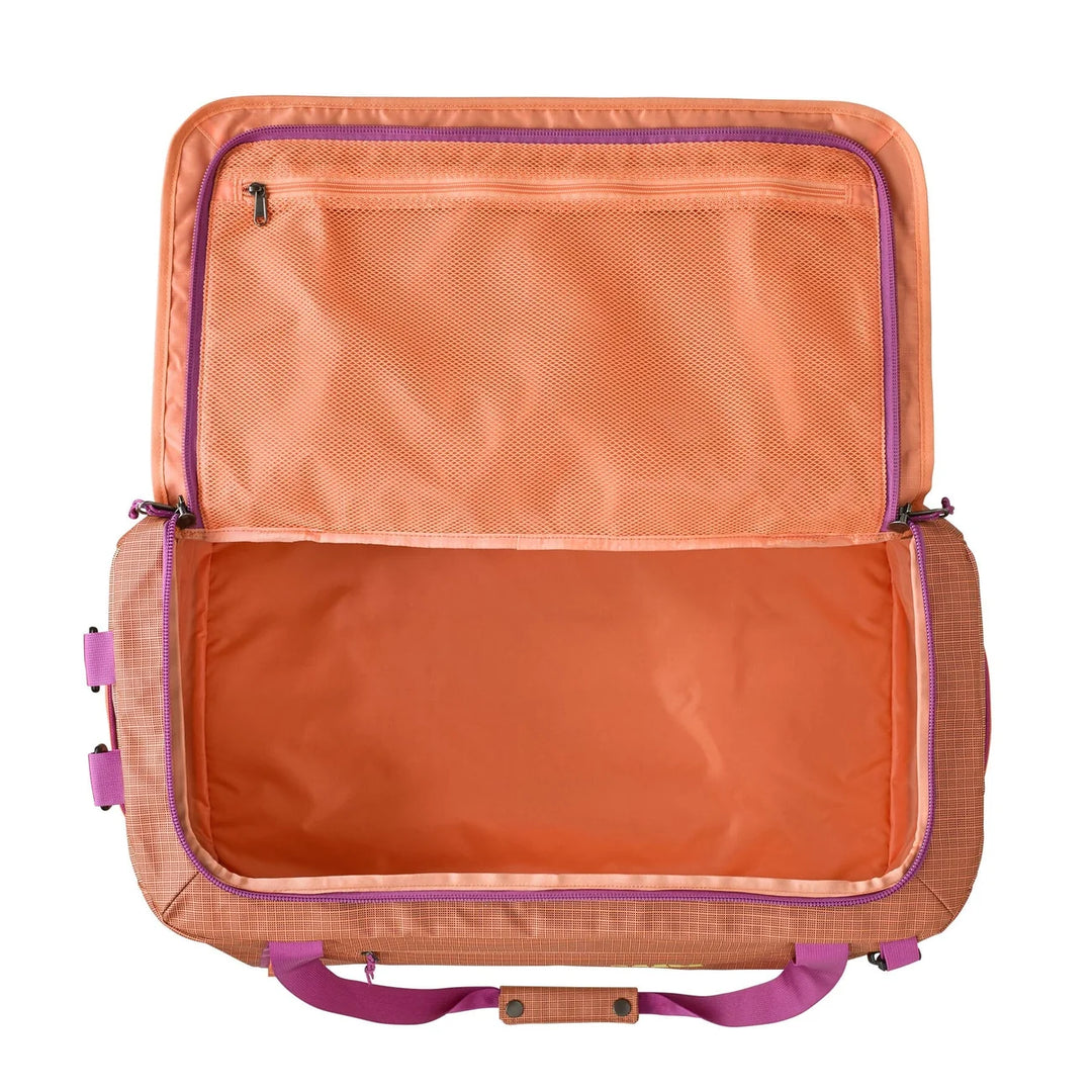 Black Hole Duffel 55L Peach Sherbet open showing the main compartment and mesh lid pockets
