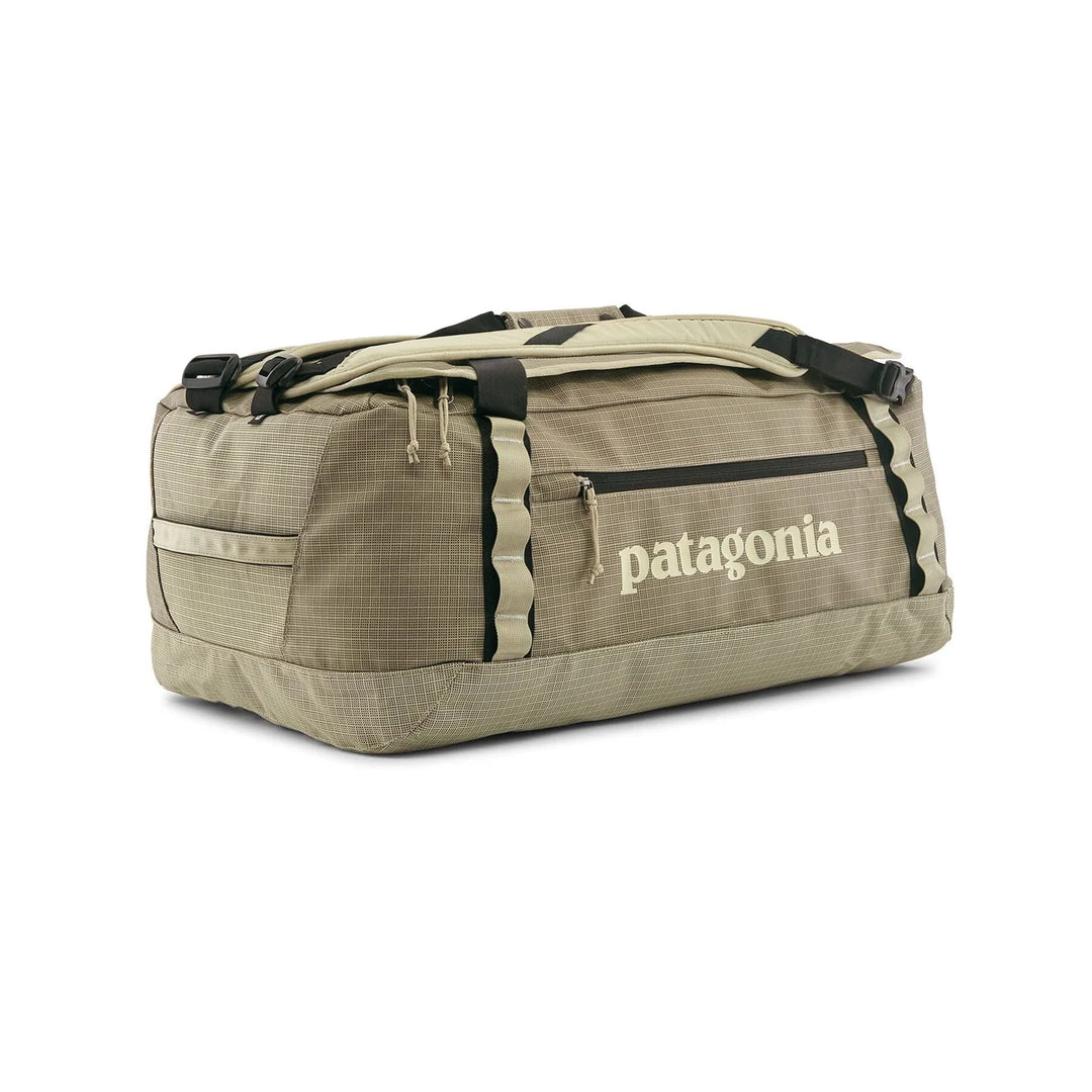 Patagonia Black Hole Duffel 55L Weathered Stone — side view in duffel mode with cream logo